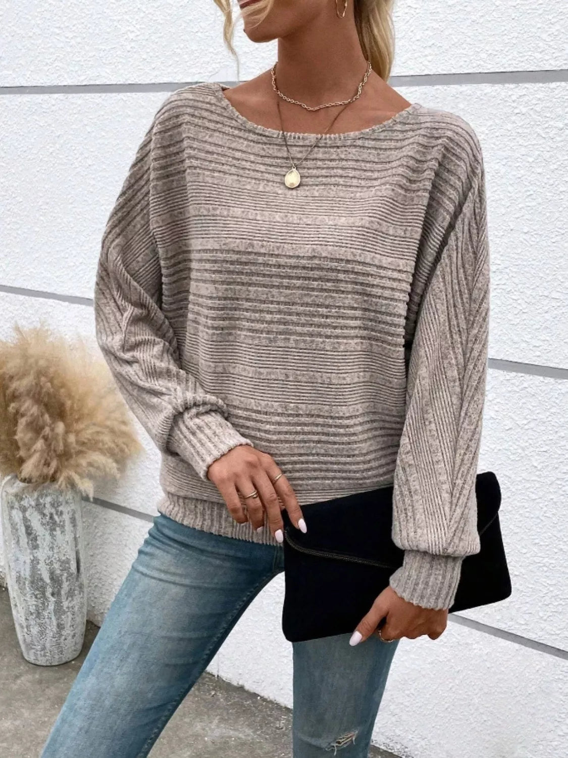 Side view of mocha relaxed fit ribbed knit top