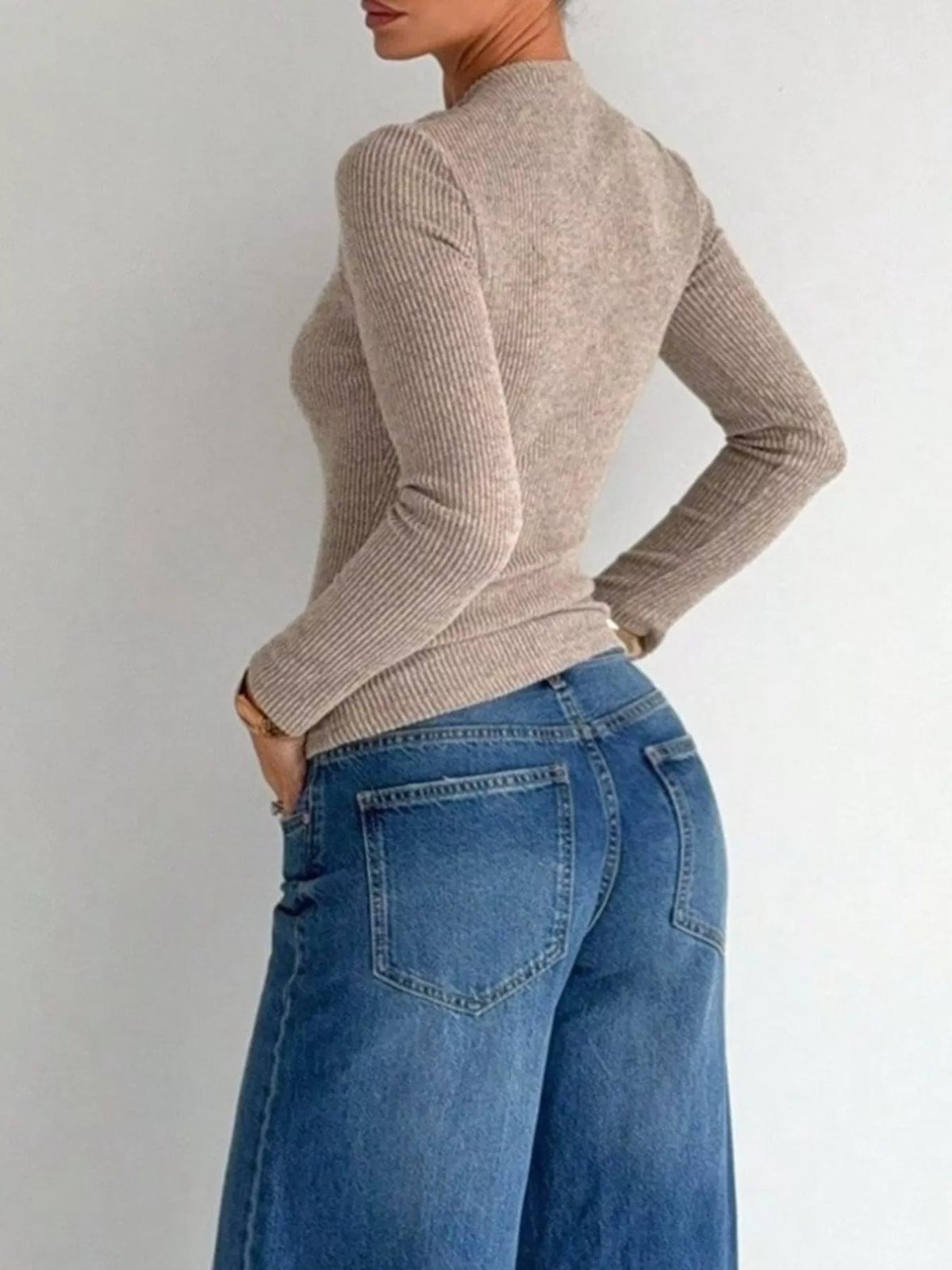 Navy blue ribbed knit long sleeve t-shirt with metal ring cutout, front view