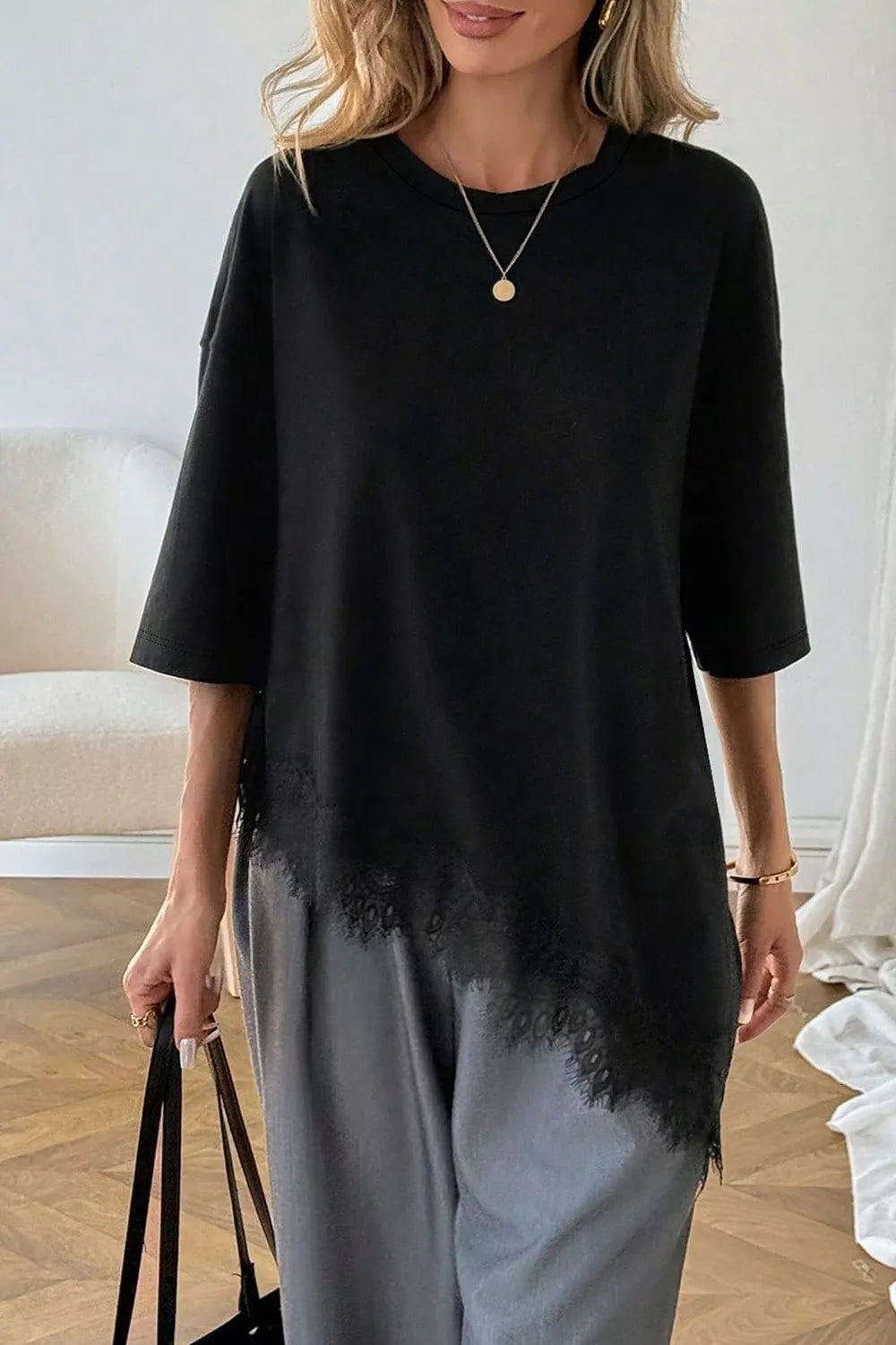 Black oversized lace asymmetrical hem t-shirt, front view