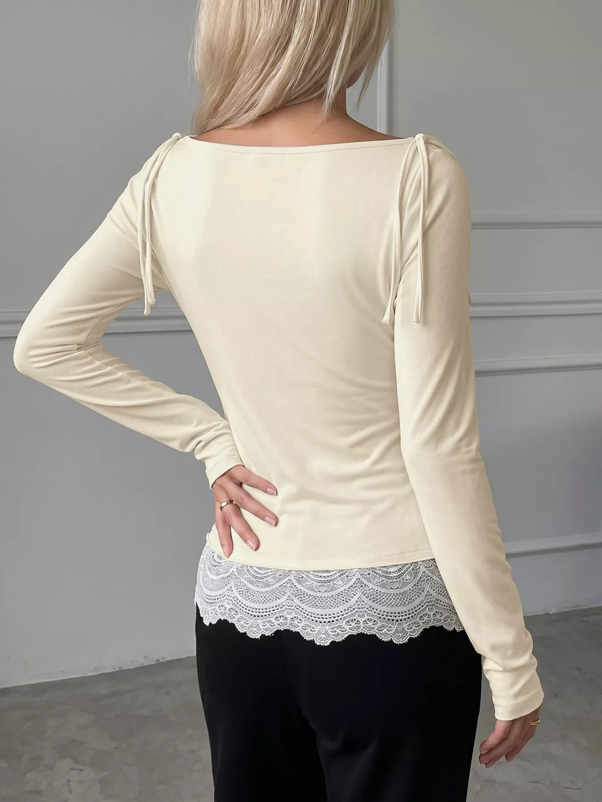 Model wearing apricot lace trim long sleeve t-shirt, styled outfit