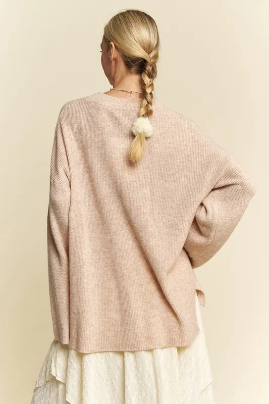 Close-up of ribbed knit texture on oatmeal high-low sweater