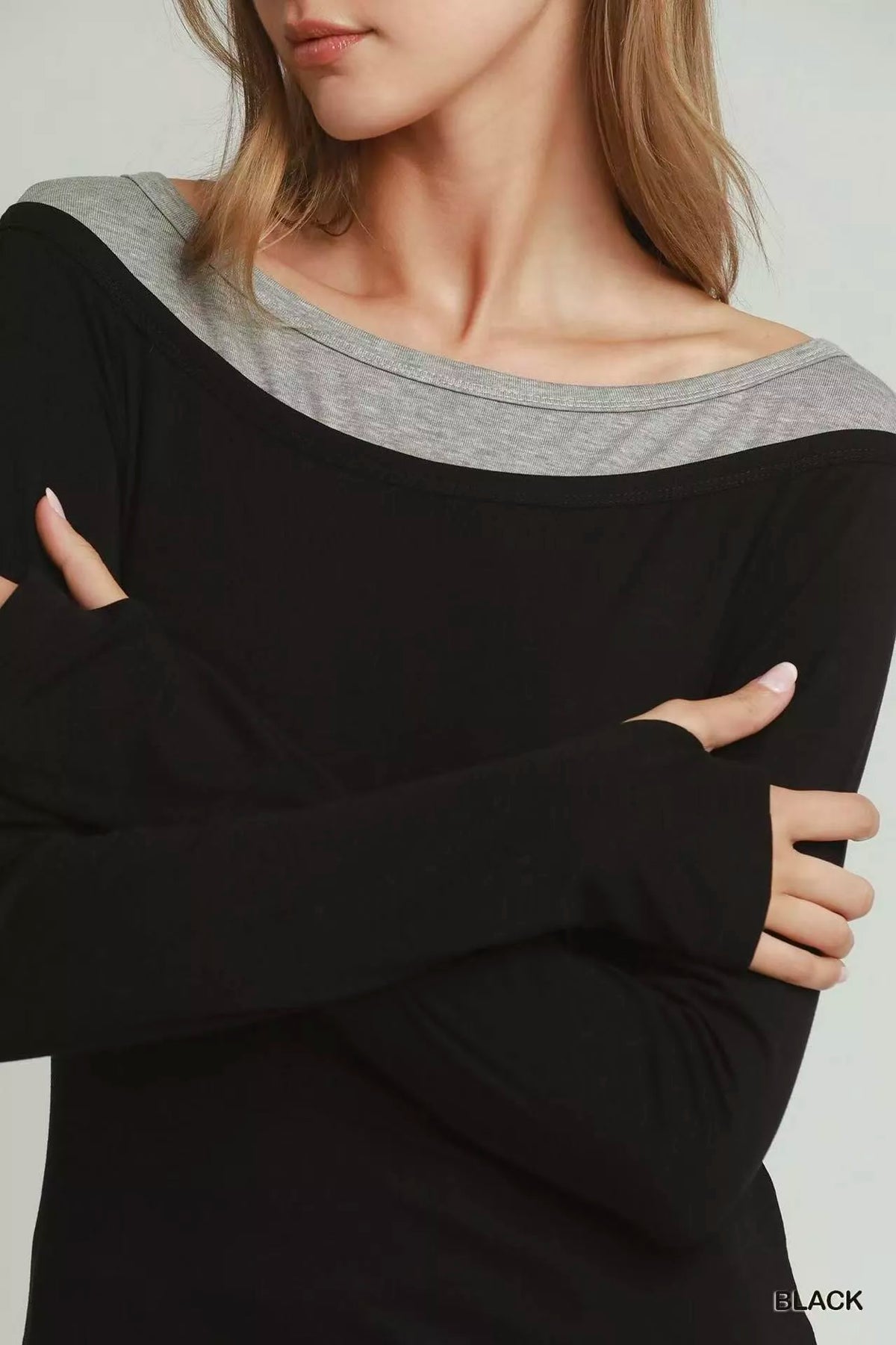 Model wearing black Umgee layered twofer top, styled outfit